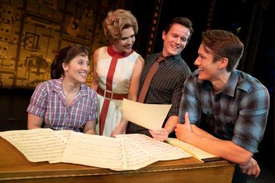 Actors around a piano reading music