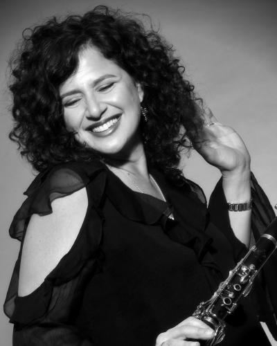 Black and white image of Anat Cohen with her instrument