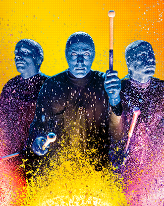 Blue Man Group on an orange and yellow background playing drums with paint