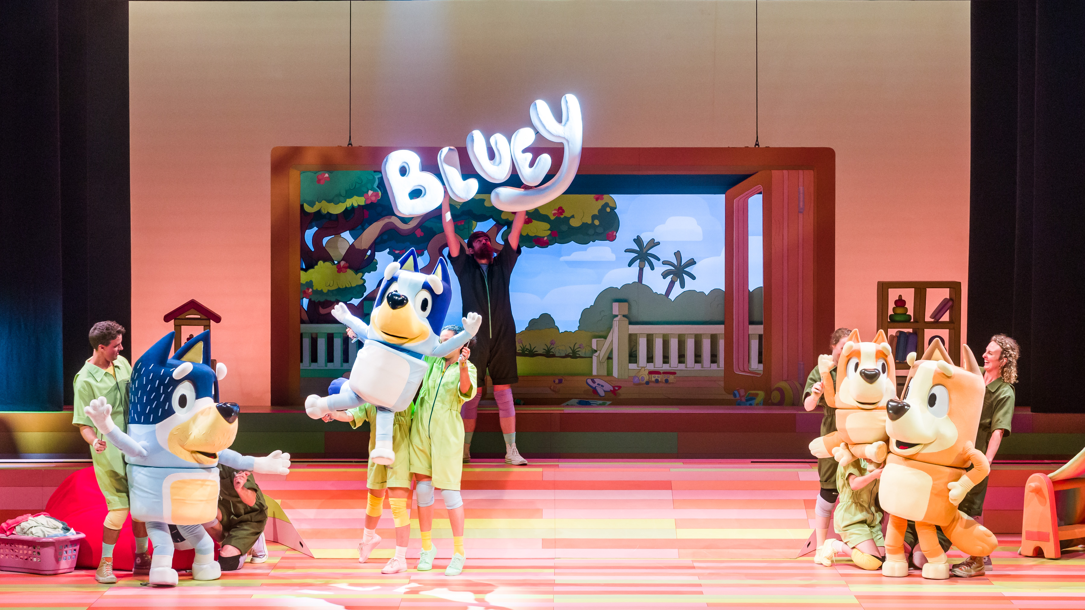 Bluey puppets on stage dancing