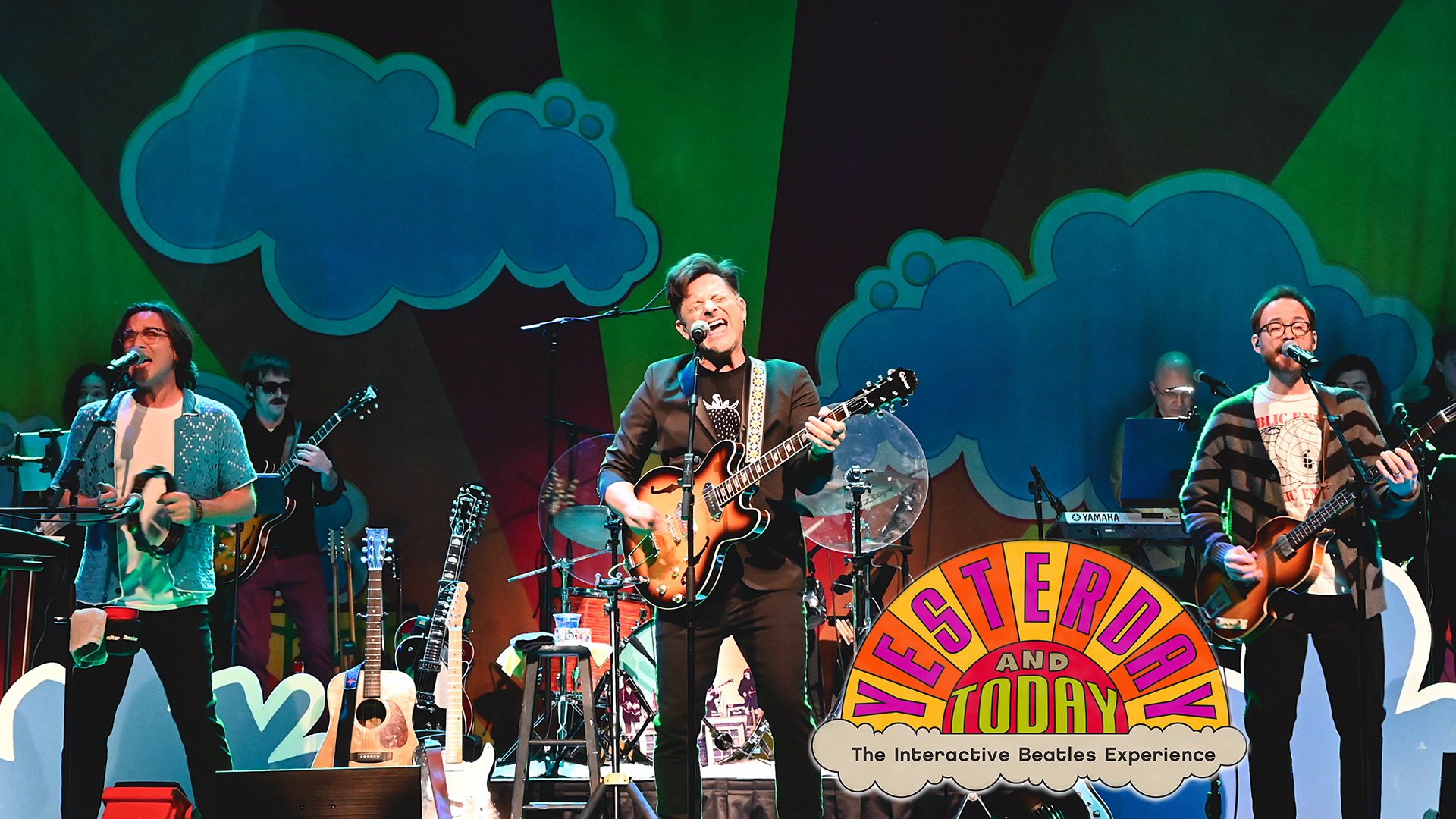 A band playing with a colorful background with clouds