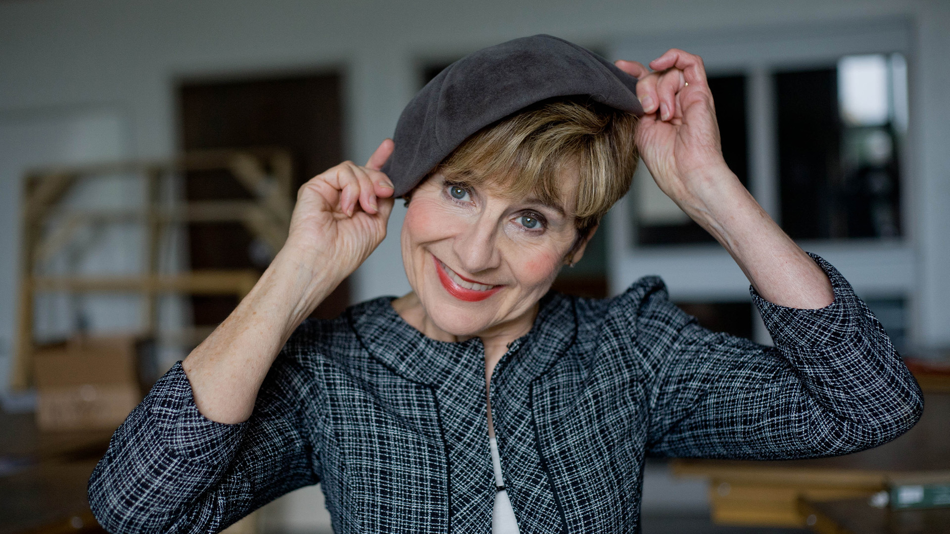 Woman looking at camera wearing hat