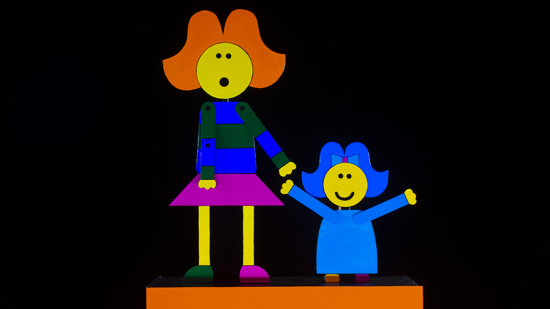Two colorful, illustrated figures hold hands