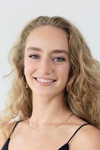 Young white woman with long blond curly hair